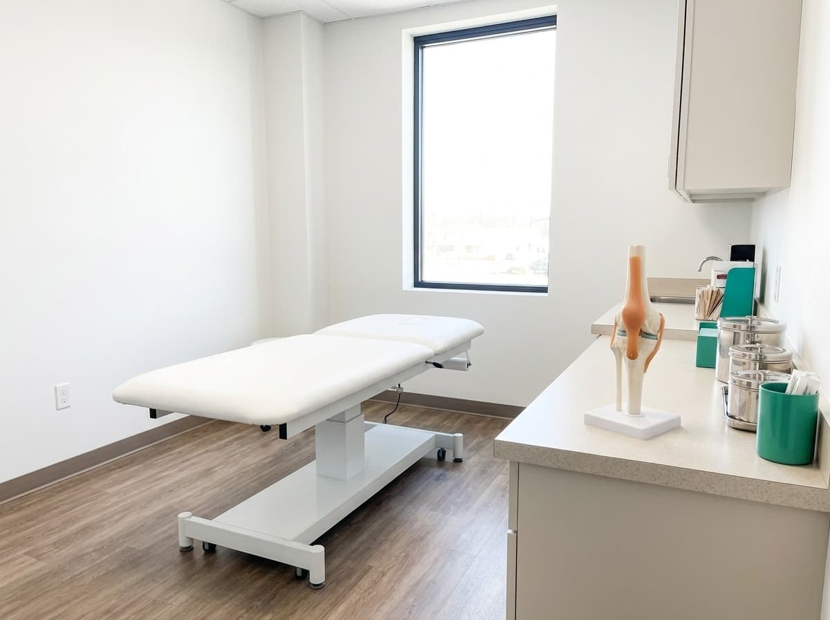 Knee exam room with joint model at Simply Health Integrated Medical, St. Louis